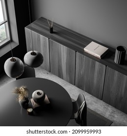 Dark grey living room with round dining table, concrete floorand sideboard. Concept of modern living room combo design. 3d rendering. Top view.