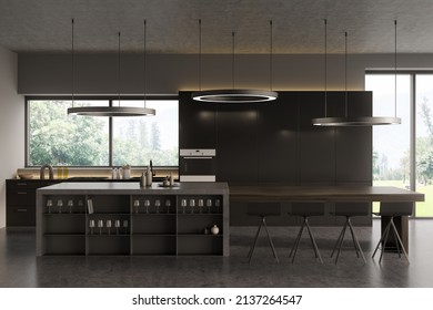 Dark Kitchen Interior With Bar Chairs And Island With Dishes, Cooking Space On Grey Concrete Floor. Luxury Kitchen With Panoramic Window. 3D Rendering