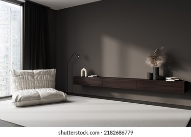 Dark Living Room Interior With Pouf Chair, Side View, Carpet On Grey Concrete Floor. Drawer With Art Decoration, Panoramic Window On Singapore City View. Mockup Copy Space Wall. 3D Rendering