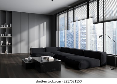 Dark Living Room Interior With Sofa And Coffee Table, Side View Hardwood Floor. Relaxing Zone With Panoramic Window On Skyscrapers. 3D Rendering