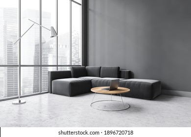 Dark Living Room With Large Window, Black Corner Sofa And Coffee Table With Laptop, Side View. Sofa On Marble Floor And Lamp, Window With City View, 3D Rendering No People