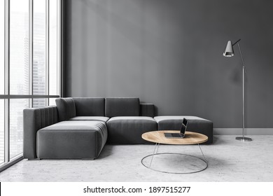 Dark Living Room With Large Window, Black Corner Sofa And Wooden Coffee Table With Laptop. Sofa On Marble Floor And Lamp, Window With City View, 3D Rendering No People