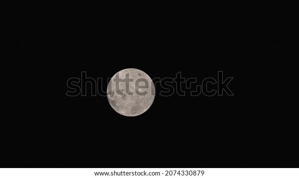 Dark moon, view from space, moon in the\
distance, dark side of the moon, 3d\
render