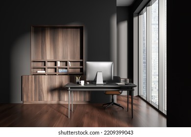 Dark Office Interior With Work Zone, Desk With Pc Computer And Shelf With Decoration, Hardwood Floor. Panoramic Window On Skyscrapers. 3D Rendering