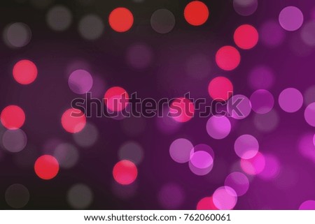 Dark pink and red circular bokeh, abstract background.
 