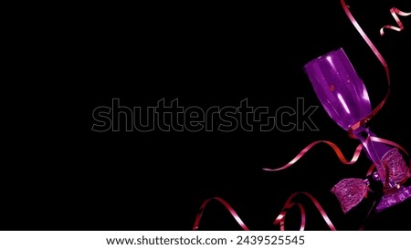 Dark purple glass tied with purple ribbon on simple black background Imagine de stoc © 