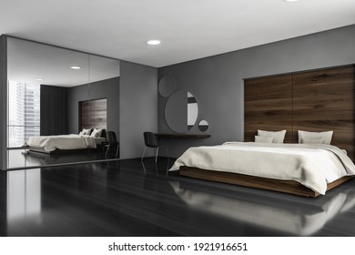 Dark Sleeping Room, Bed And Chair With Desk On Black Floor, Side View. Minimalist Design Of Bedroom With Coffee Table, Windows With City View, 3D Rendering No People