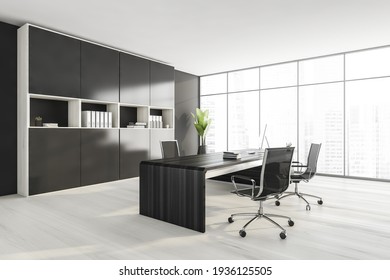 Dark Wall Office Room With Table And Desktop Computer, Side View, Armchairs On White Parquet Floor. Shelf With Business Files, Plant With City View. 3D Rendering, No People