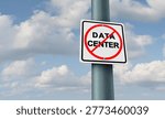 Data Center ban and Data-Centers protest as a sign showing public revolt against large technology installations as a policy that restricts or prohibits the construction or expansion of large computing facilities due to concerns on energy use grid strain and environmental impact.