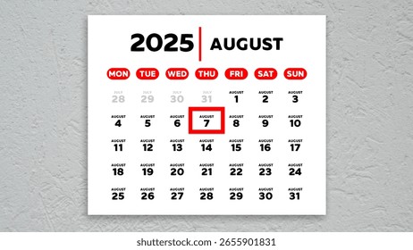 The date August 7th marked with a red cursor on the wall calendar 2025