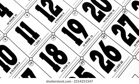 The date numbers on the large calendar are white and black. The dozenth date is photographed in close up. Southeast Asian calendar, Indonesia. A collection of dates of a month with the name of the day - Powered by Shutterstock