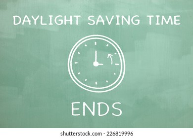 Daylight saving time illustration drawn on a chalkboard to indicate the end of the daylight saving time.  - Powered by Shutterstock