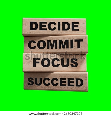 Decide Commit Focus Succeed symbol. Concept words Decide Commit Focus Succeed on wooden blocks.Business concept. Copy space.3D rendering on Green Screen for footage and clipping path.