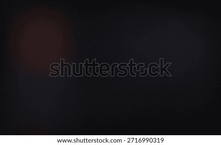 A deep, dark background with subtle, diffused hints of reddish-brown and blue light.