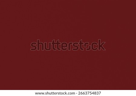 A deep red background with a smooth texture. The background is uniformly red, creating a bold and striking visual effect. Colorful creative background with copy space.
