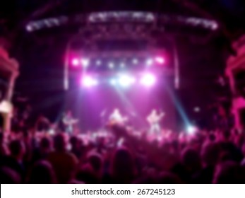 Defocused   people at the concert, the club floors - Powered by Shutterstock