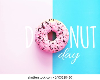 Delicious donuts on light pastel color background. National Donut Day concept. - Powered by Shutterstock