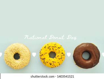 Delicious donuts on light pastel color background. National Donut Day concept. - Powered by Shutterstock