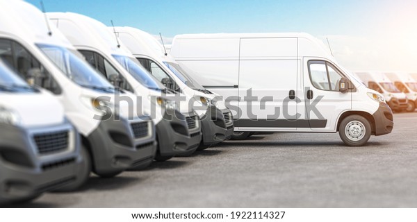 Delivery vans\
in a row with space for logo or text. Express delivery and shipment\
service concept. 3d\
illustration
