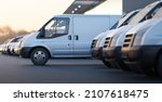 Delivery vans standing out from a fleet of white vans. Express delivery and shipment service concept. 3d rendering