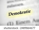 Democracy - German text word with light highlighting