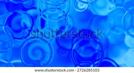 Dense bubble pattern in vivid blue with soft shadows for depth; tactile, glossy surface.