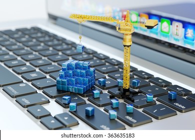 Designing, engineering, business planning and project development, computer technology concept, construction crane on laptop keyboard assembles abstract blue blocks - Powered by Shutterstock