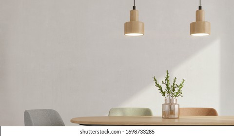 Detail of modern dining room interior minimal style.Chairs,table,glass vase and ceiling lamp with sunlight on white wall background.3d rendering