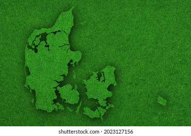 Detailed and colorful image of map of Denmark on green felt