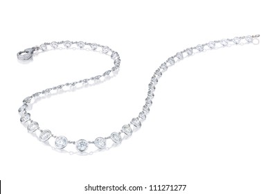 Diamond  Necklace On A White Background With Reflection