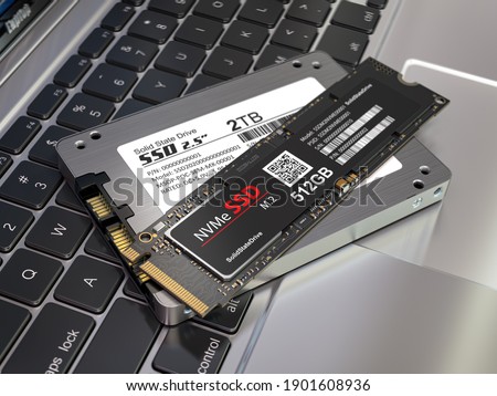 Different types of SSD disk drive isolated on laptop keyboard. Classic SSD and SSD m2. 3d illustration 商業照片 © 