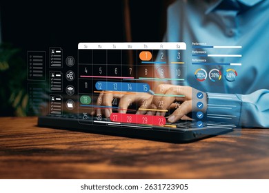 Digital Calendar Interface with Performance Metrics Displayed on Hands Typing at Laptop Desk, Business concept