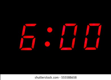 Digital clock closeup displaying 6:00 o'clock