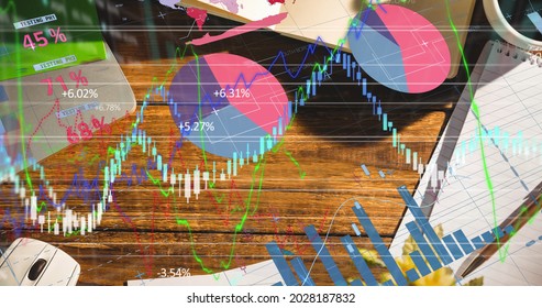 Digital composite image of financial data processing office equipment on office desk. global finance and business concept
