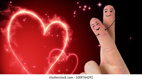 Digital composite of Valentine's fingers love couple and illuminated hearts - Powered by Shutterstock