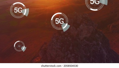 Digital Image Of Futuristic Circles Moving Around 5G With Background Of A Rocky Mountain During The Sunset 4k