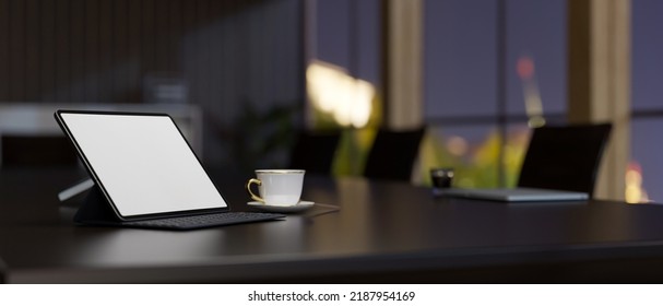 Digital Tablet Touchpad White Screen Mockup And Coffee Cup On Modern Dark Meeting Table In The Meeting Room. Close-up Image. 3d Rendering, 3d Illustration