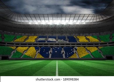 Digitally generated brazilian national flag against large football stadium