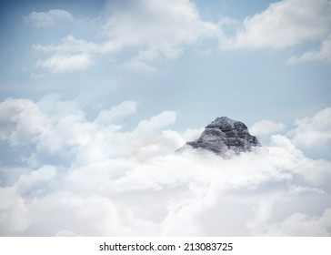 Digitally Generated Mountain Peak Through The Clouds