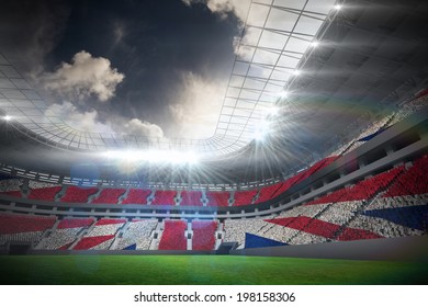 Digitally Generated Uk National Flag Against Football Stadium With Fans In White