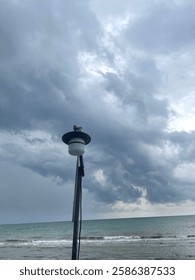 dim lights on the beach with cloudy conditions
