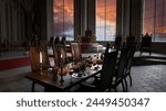Dining table set for a banquet in an old medieval royal throne room. 3D render.