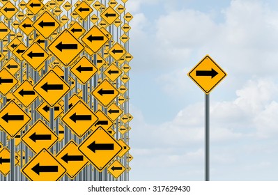 Direction individuality and independent thinking concept as a group of directional arrow traffic signs with one individual pointing in the opposite way as a business icon for innovative solution.