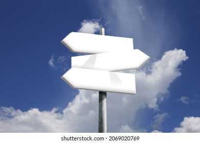 Direction road sign with arrows on sky and clouds background. - Shutterstock ID 2069020769