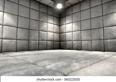 A dirty white padded cell in a mental hospital