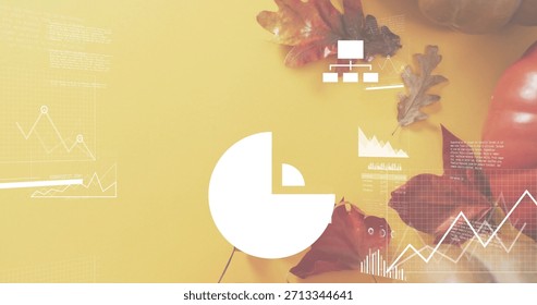 Displaying white pie-chart centered on mustard tabletop, showing line graphs, oak leaves, pumpkin. Infographic, dashboard, flatlay, autumnal, editorial, marketing, minimal