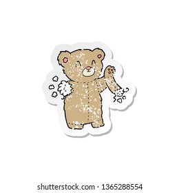distressed sticker cartoon teddy bear and torn arm