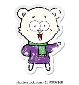 distressed sticker laughing teddy  bear cartoon in winter clothes