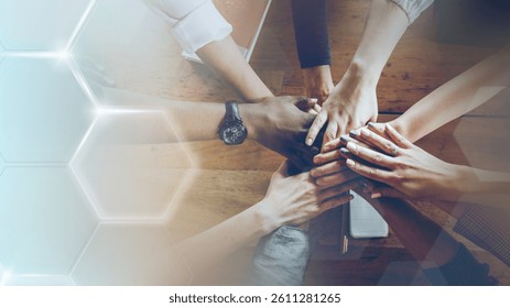 Diverse hands in teamwork, unity, and collaboration. Teamwork and unity among diverse hands symbolize collaboration and diverse teamwork. Diverse business teamwork and collaboration concept.