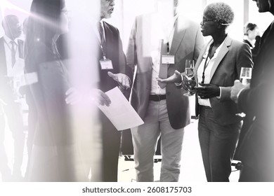 Diverse professionals networking. Business attire, conversation, and networking. Group of professionals in networking. Business professional, business meeting, business networking activities concept. - Powered by Shutterstock - Get 15% off with code: PIKWIZARD15